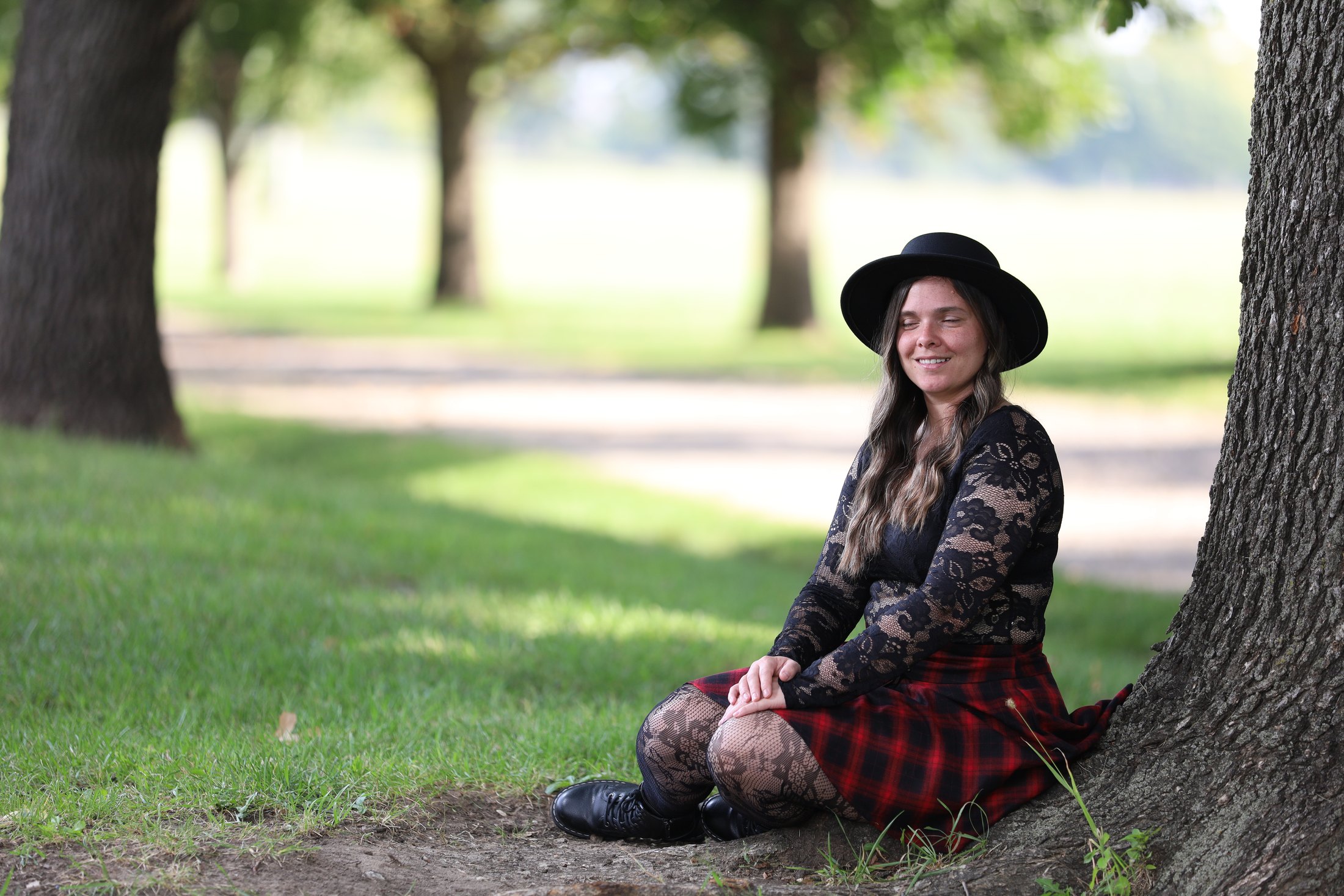 Creative seated portrait in soft outdoor light