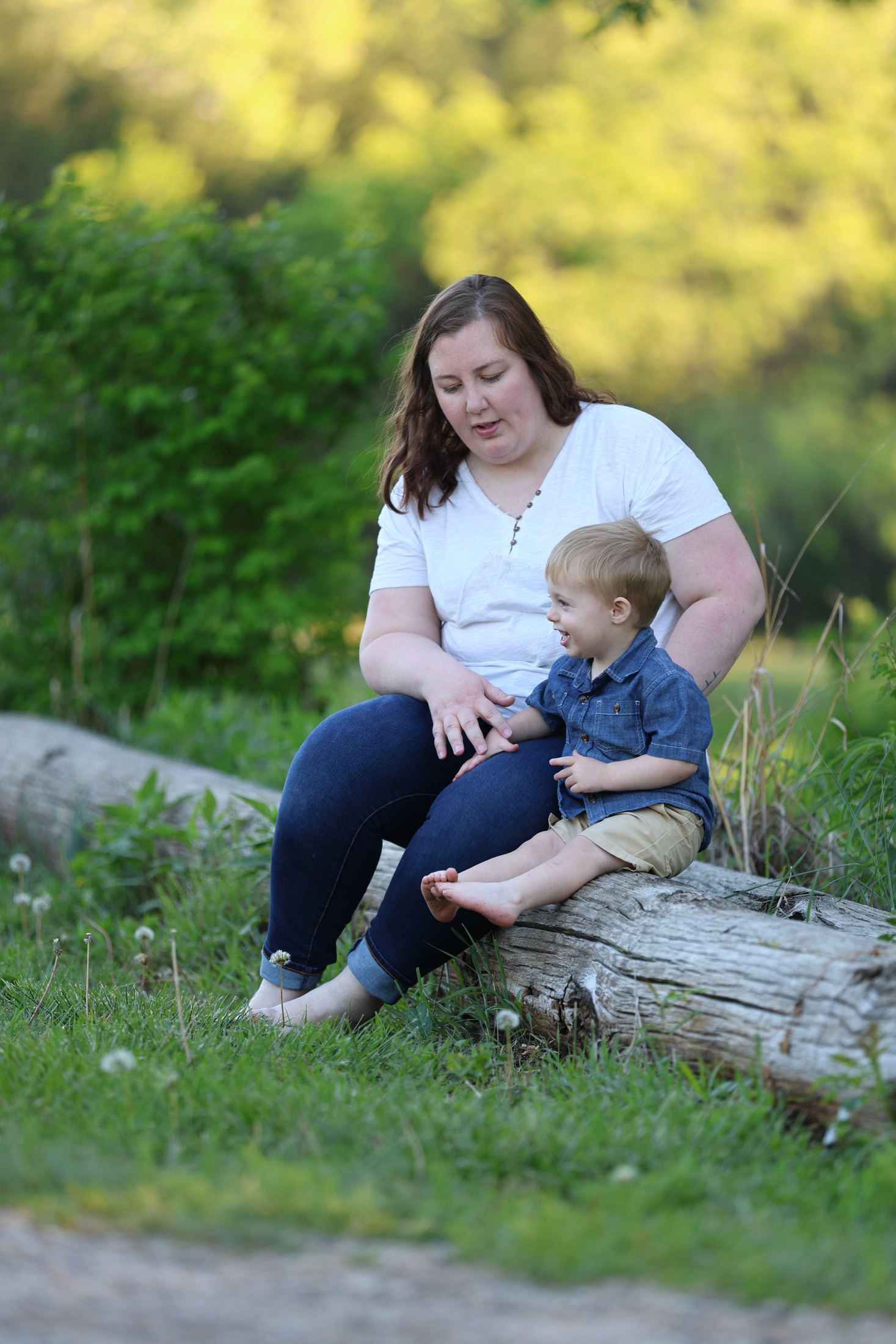 Mother and child seated together during a family session