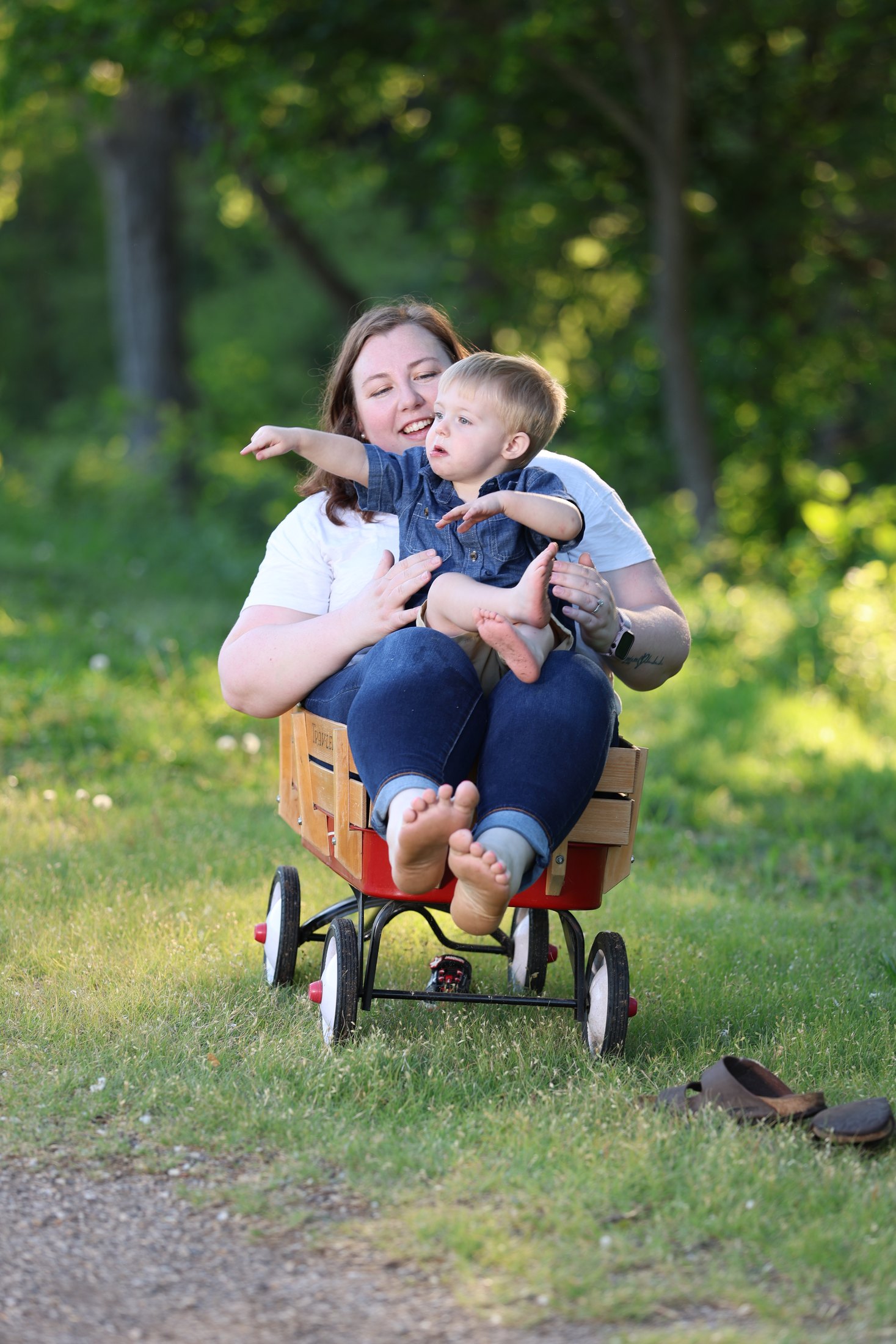 Playful family portrait with a red wagon