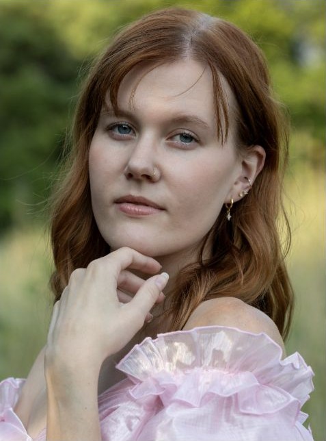 Soft formal outdoor portrait in a pink dress