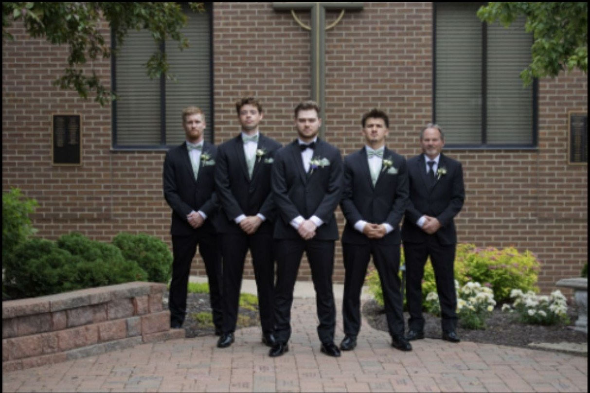 Formal groomsmen portrait outdoors before a wedding