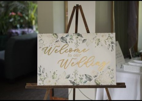 Wedding welcome sign displayed on an easel