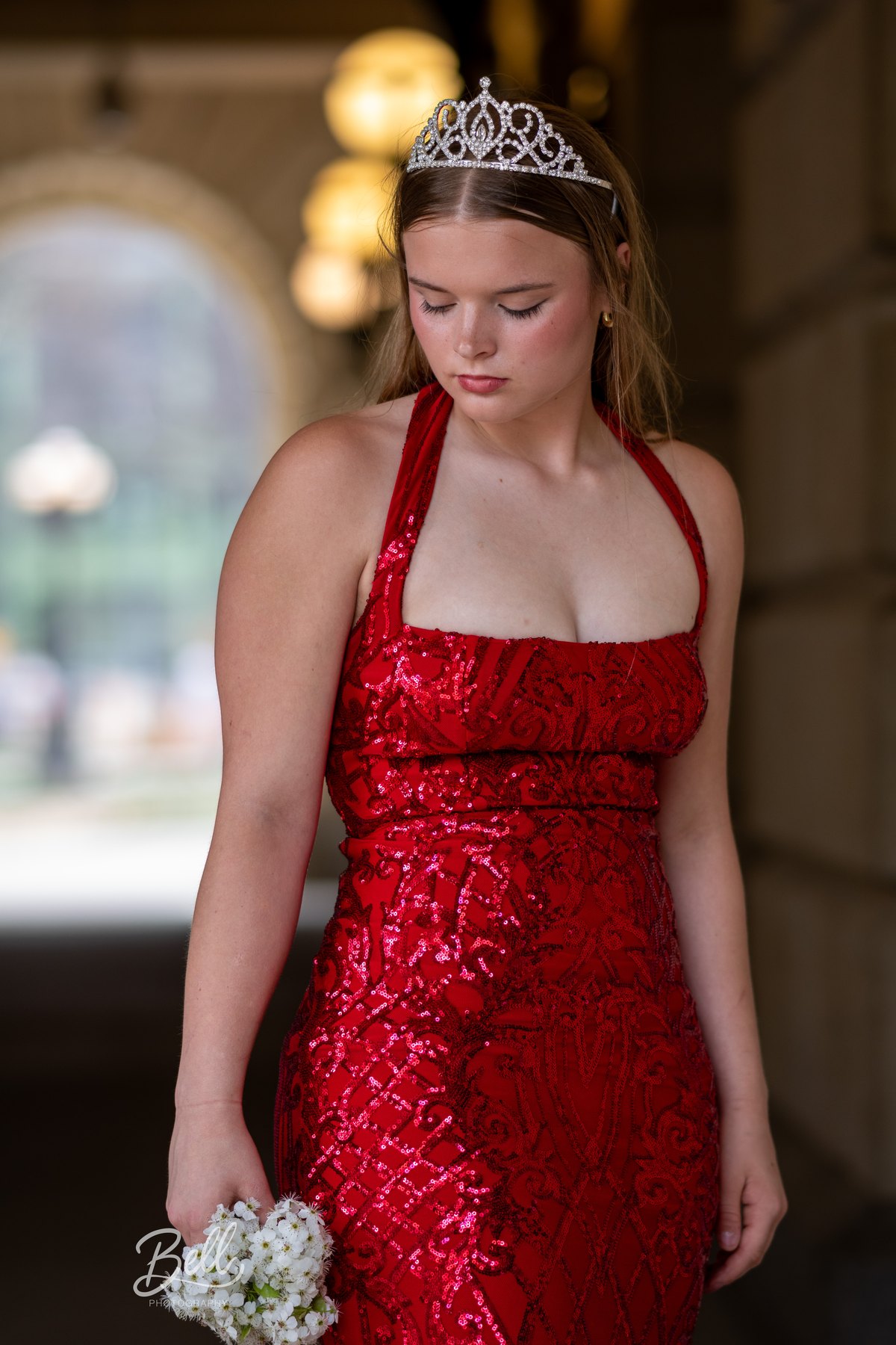 Formal senior portrait in a red dress
